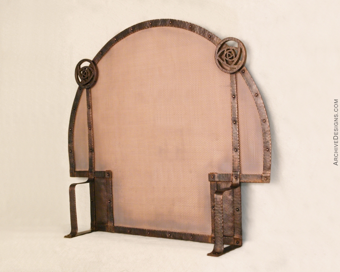 Hammered copper screen for arched fireplace, by Archive Designs.
